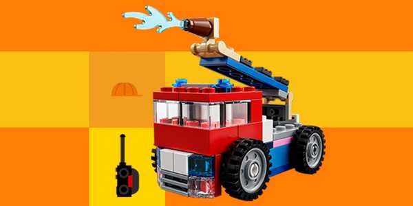 A LEGO® fire engine build against yellow background.